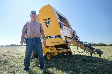 Jeff Jones stands in front of his Vermeer 504R Premium baler